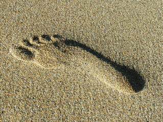 Photo of a footprint in the sand