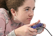 Photo of a girl playing a video game